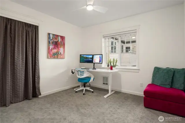 The second bedroom with a nice sized closet and overhead fan.