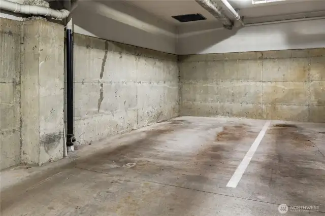 A sought after end parking space with easy in-and-out access in this very clean and secure garage.