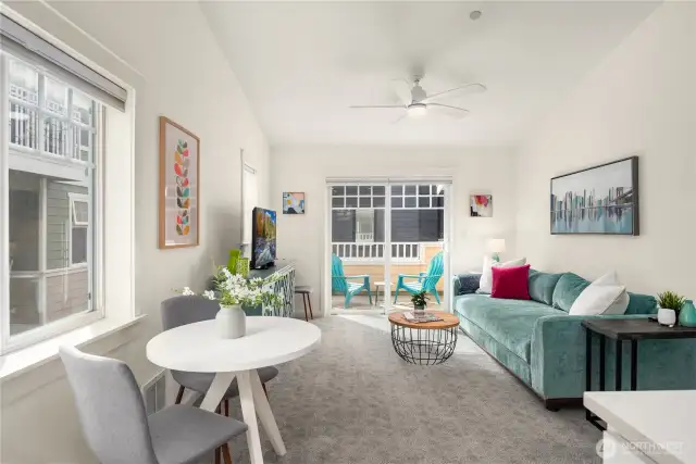 The living room / dining room features new paint, sheet rock, flooring and more.