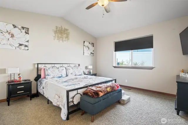 large primary bedroom in rear of home