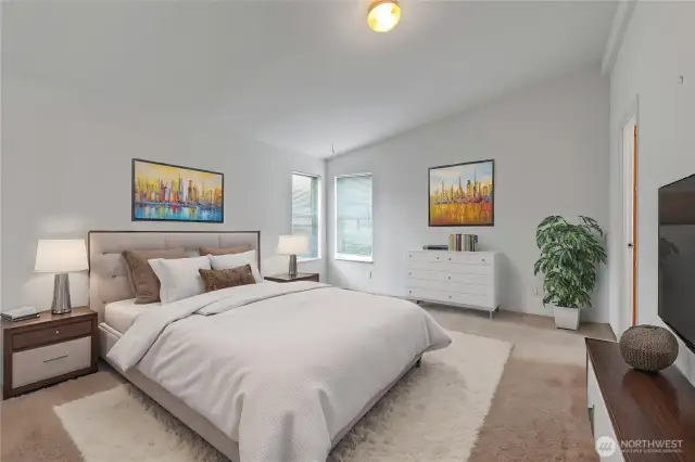 Primary suite is good size and includes a walk-in closet and large bath.  This has been virtually staged here for your enjoyment.