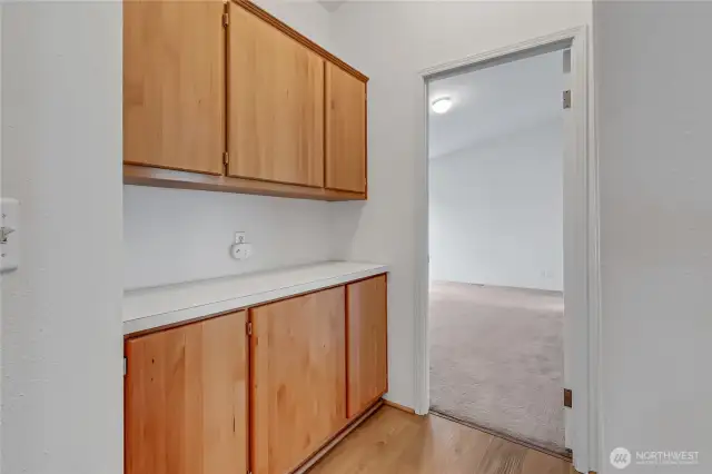 This nice set of cabinets and counter space is in the hallway outside of the two bedrooms