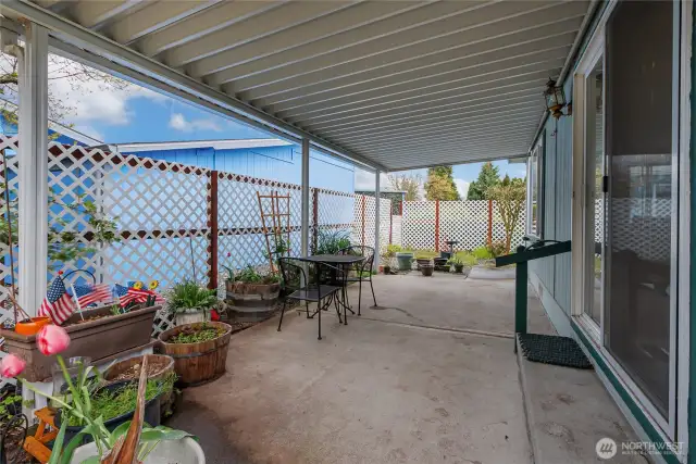 This is the wonderful large covered patio off of the dining area. The pretty lattice work was recently added for appeal and a little more privacy.