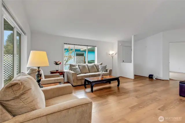 Another angle of the living room towards the front entry and the spacious den/office off the living room.