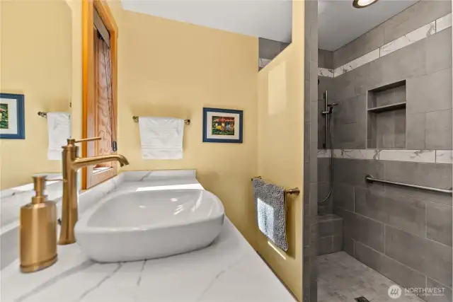 Escape the pressures of the day in your light and airy walk -in shower. Natural light streams through the windows.