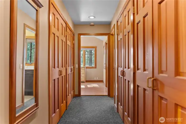 Dressing room in primary bedroom entrance allows dressing without disturbing your partners sleep! Pocket door at end of hallway closes off primary bedroom suite when desired.