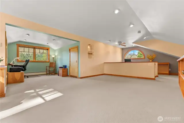 Open and bright second floor with windows on all sides. Wall of  the desk alcove as a bedroom and still plenty of space for rec room and office at the other end. Check out the view from the rounded Palladian window  that frames Mount Gardner!!