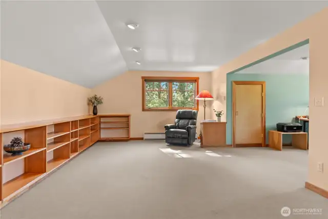 Bright and sunny flex-bonus space. Gorgeous vertical grain fir built-ins end clutter and gives unity to the room!