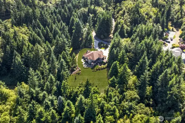 Tucked away on 10 private, sun-drenched acres in one of North Bend’s most coveted communities—just minutes from trails, rivers, vibdowntown, and I-90