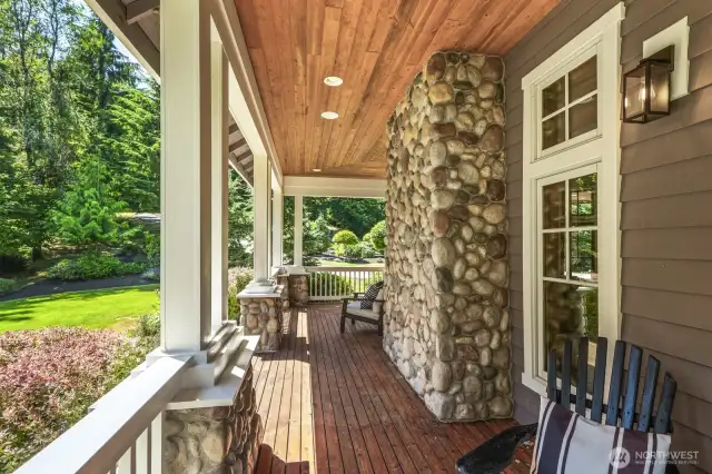 Expansive and beautiful wrap-around porch extends along two sides of the home.