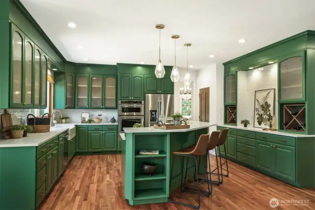 All stainless steel appliances stay, including the garage refrigerator and wine fridge.