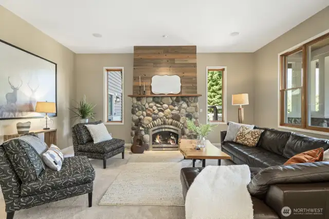 New carpet in the family room, featuring thoughtful built-ins and additional cozy gas fireplace.