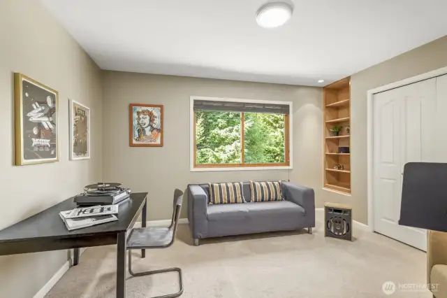 Additional bedroom features large closet + custom built-ins—ideal for storage, study, or creative space.