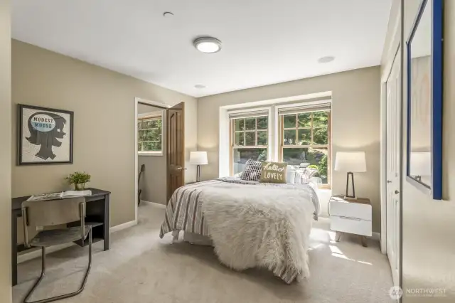 Fourth bedroom includes its own ¾ bath and a charming Juliet balcony.