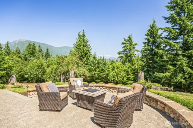 Enjoy breathtaking views from the expansive patio, complete with included furniture for effortless outdoor living.