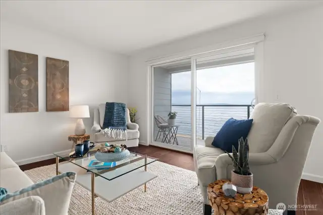 Generous great room with sliding glass door, offering access to private, covered deck