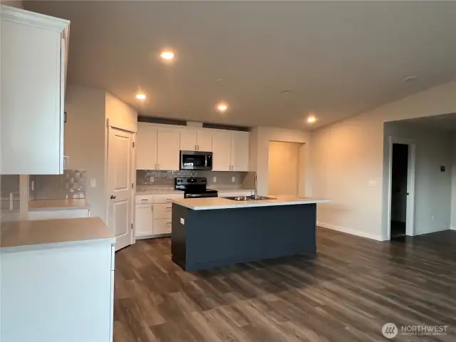Kitchen and hallway to Primary Suite