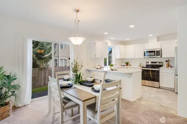 The dining room flows seamlessly into the kitchen for easy meals and gatherings.