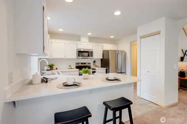 Light and bright! Kitchen upgrades include a brand-new sink, modern faucet, and sink disposal.
