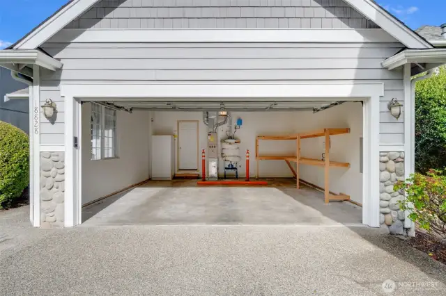 The garage offers shelving for extra storage. Clean and move in ready!