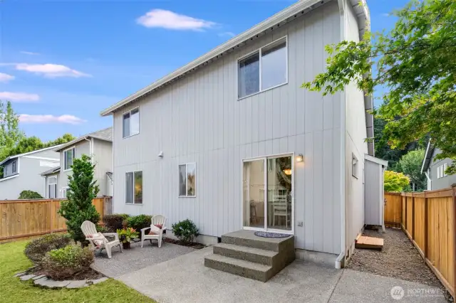 The back patio offers a nice outdoor space for enjoying long summer evenings or barbecues.