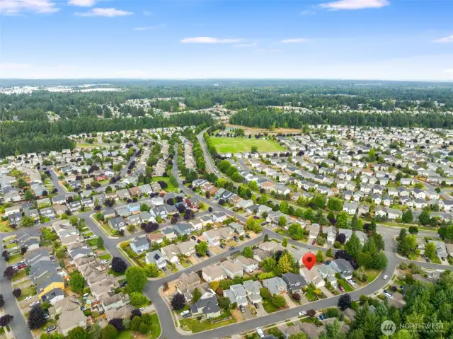 The home offers access to shared amenities including a clubhouse, parks, athletic courts, and walking trails.