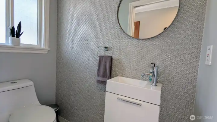 Charming 1/2 Bathroom, off living room with ceramic penny tiles!