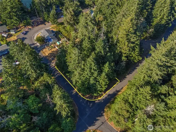 Picture your Dream House here on this large level corner lot.