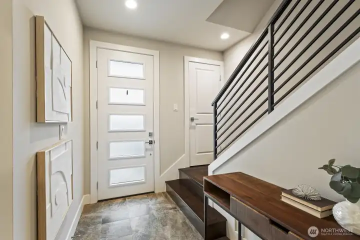 Let's go upstairs, with upgraded hardwood steps and rod iron railing