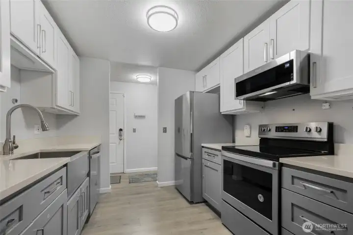 A view from the galley kitchen towards the front door.