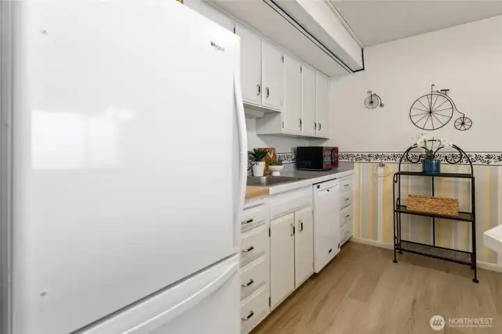 Kitchen view with new refrigerator.