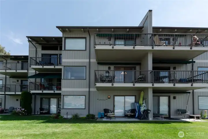 Exterior view of unit with large lake view deck.