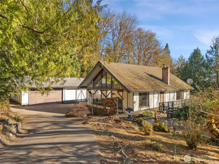 A highly desirable setting. Paved circular driveway. Ample garage space.