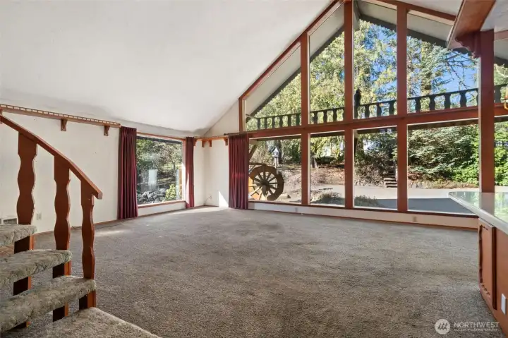 Great Room with floor to ceiling windows.