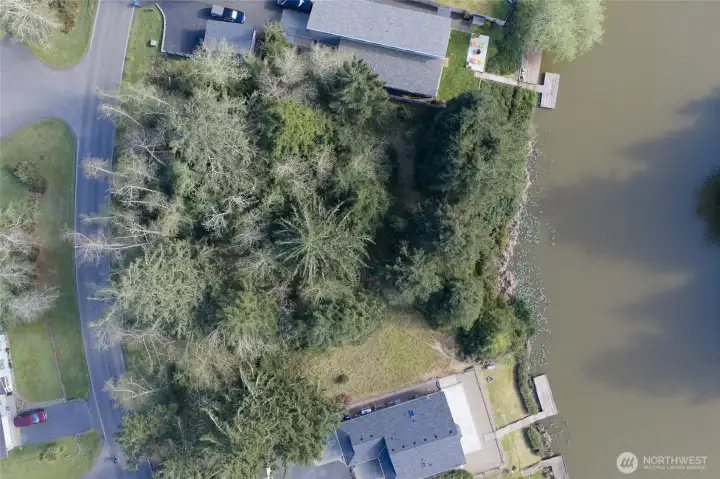 Parcel for sale is in between two other vacant lots.