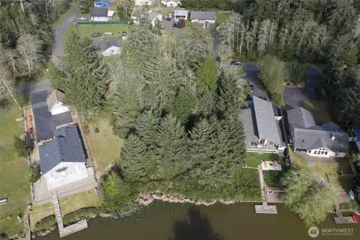 Parcel for sale is in between two other vacant lots.