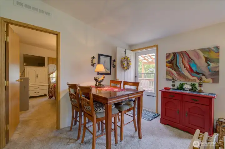 Front entry area from living room.  Doorway leads into the primary bedroom.