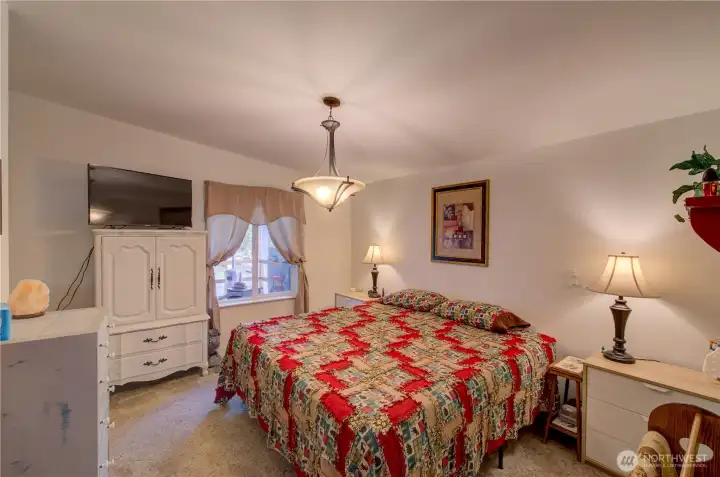 Super spacious primary bedroom with king sized bed.  Plenty of room for additional furniture.