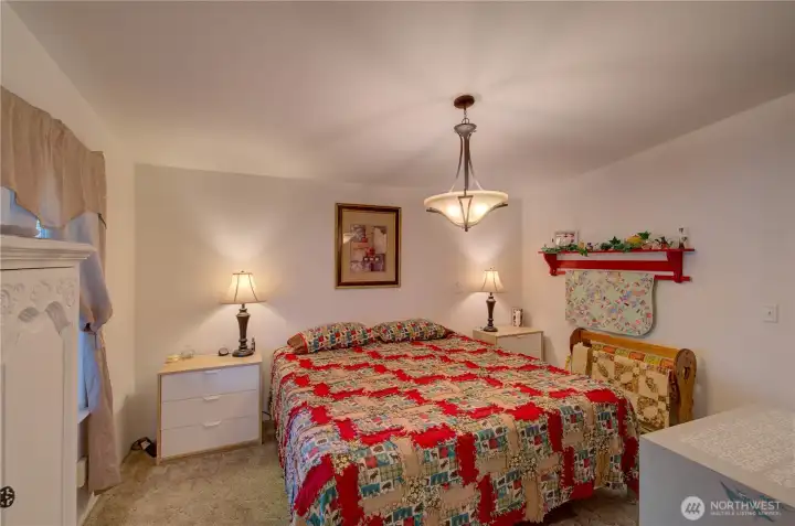 Another view of primary bedroom from ensuite bath.