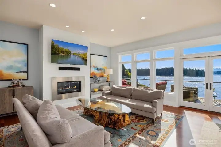 Natural light pours into the living areas of this home with walls of glass to capture the view. Natural light pours into the living areas of this home with walls of glass to capture the view.