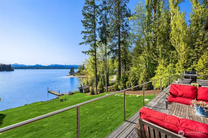 The view from the deck shows the rolling lawn to the water's edge. Notice the boat storage building for your crab pots and PFD's. The storage has a concrete floor and lighting. The view from the deck shows the rolling lawn to the water's edge. Notice the boat storage building for your crab pots and PFD's. The storage has a concrete floor and lighting.