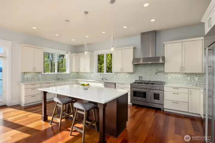 A cook's kitchen indeed! Large quartz counters allow for generous prep space. A cook's kitchen indeed! Large quartz counters allow for generous prep space.