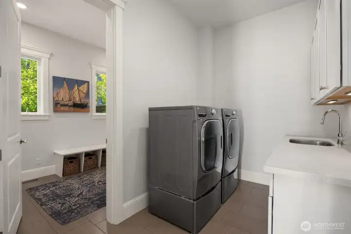 There are 2 laundry rooms. One on the main floor off the kitchen, attached to the mud room (not fully shown) and one on the upper level. There are 2 laundry rooms. One on the main floor off the kitchen, attached to the mud room (not fully shown) and one on the upper level.