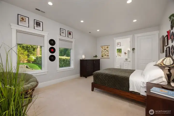 A second upper-level bedroom with views over-looking the private gardens. All 4 bedrooms in this home enjoy a private ensuite bath. A second upper-level bedroom with views over-looking the private gardens. All 4 bedrooms in this home enjoy a private ensuite bath.