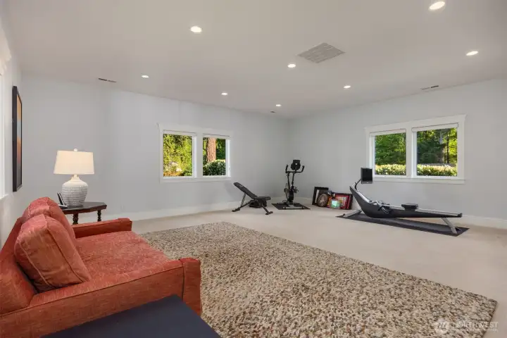 The upper-level 4th bedroom is currently used as a bonus room/exercise room and enjoys views of the private gardens. This room has an attached bath and could easily be used as a bedroom. The upper-level 4th bedroom is currently used as a bonus room/exercise room and enjoys views of the private gardens. This room has an attached bath and could easily be used as a bedroom.