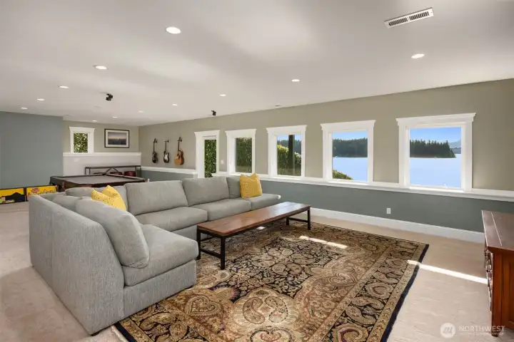 The lower-level bonus room is quite spacious and has a walk out to a patio area and access to the back yard and waterfront. Plenty of room for multiple uses such as a media room, home gym, second home office or craft space. A 3/4 bath is adjacent. The lower-level bonus room is quite spacious and has a walk out to a patio area and access to the back yard and waterfront. Plenty of room for multiple uses such as a media room, home gym, second home office or craft space. A 3/4 bath is adjacent.