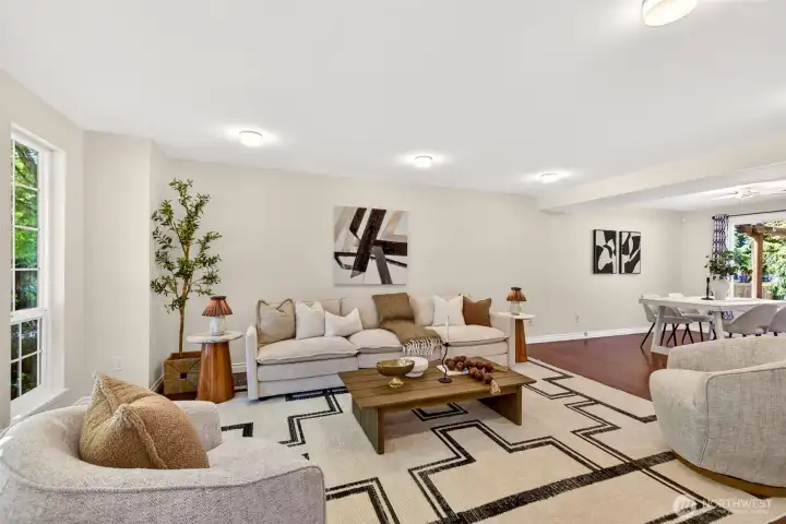 The generously sized main living room offers a versatile open layout that flows effortlessly into the dining area, ideal for everyday living and easy entertaining. Year-round comfort comes courtesy of the home's efficient heat pump system, while updated finishes provide a neutral canvas for your personal style.