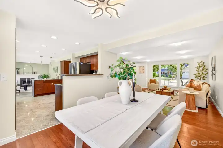 An effortless flow connects the dining area to the kitchen and living room, creating the open-concept feel today's buyers crave while preserving defined spaces for conversation. Custom dark cabinetry, stainless appliances, and quality hardwoods reflect the comprehensive renovation that sets this home apart on English Hill.