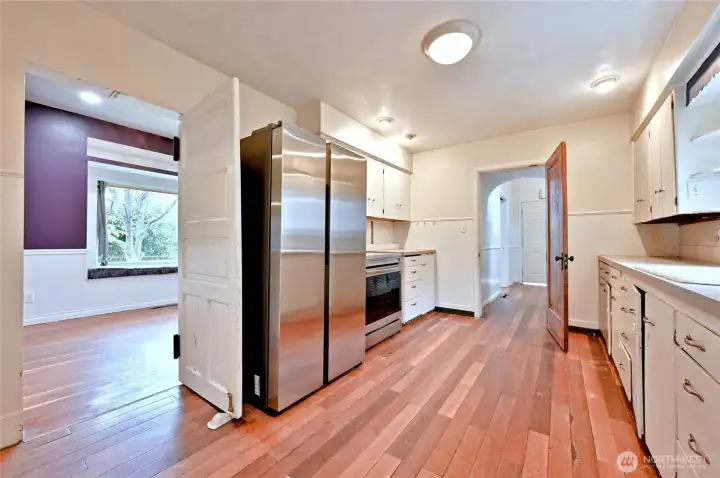 Newer appliances include refrigerator and stove/range.