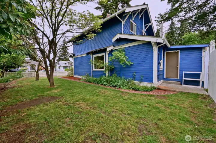 Large side yard accessible from back door as shown, or from front yard.